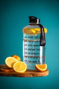 Lemon-infused water bottle with motivational text, perfect for hydration goals.